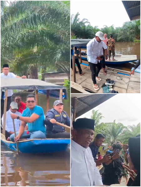 Gunakan Perahu Pompong, Bupati H Zukri SM Tinjau dan Bagikan Sembako Ke Warga Korban Banjir